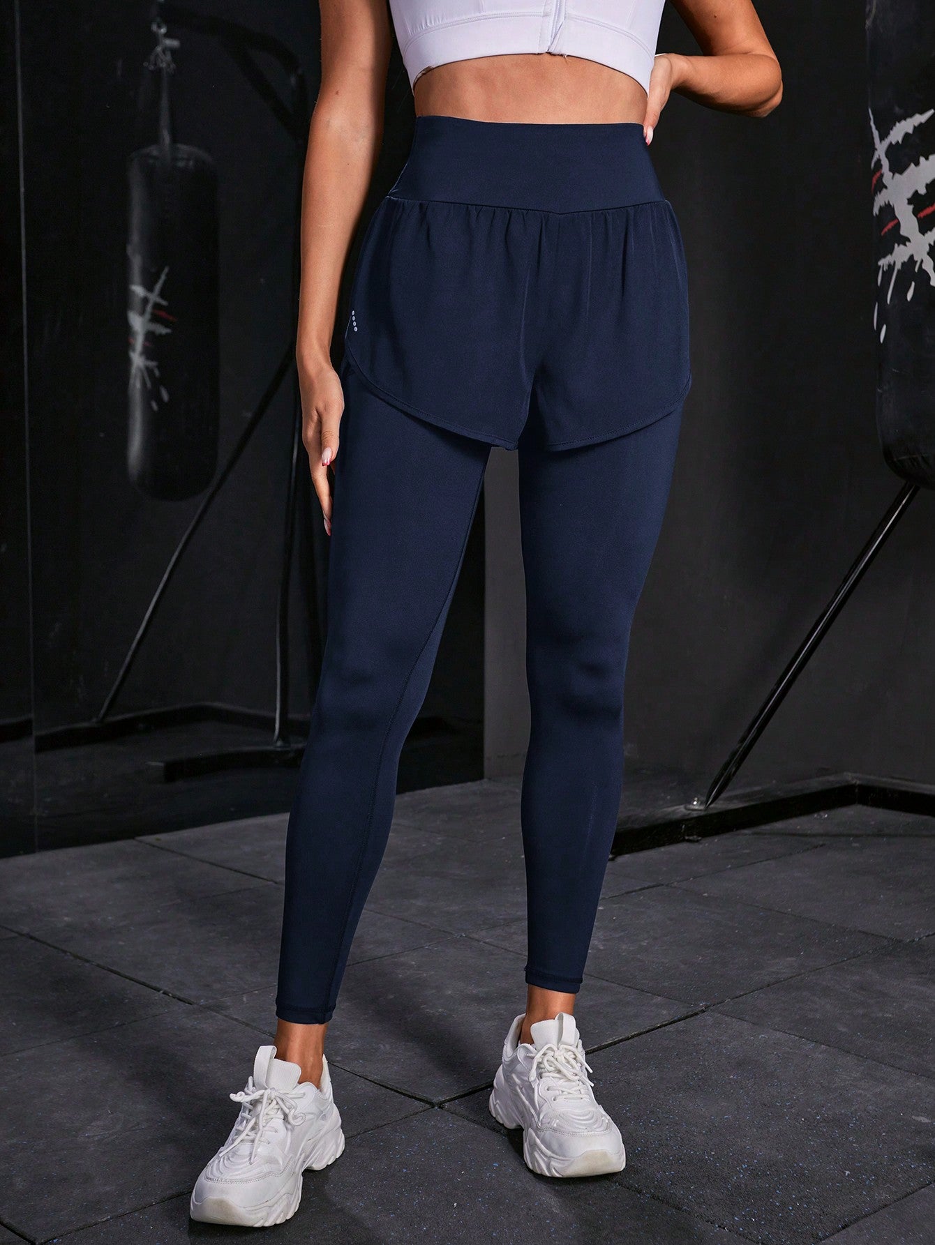 Calça Legging Fitness Com Saia Embutida E Bolso Lateral