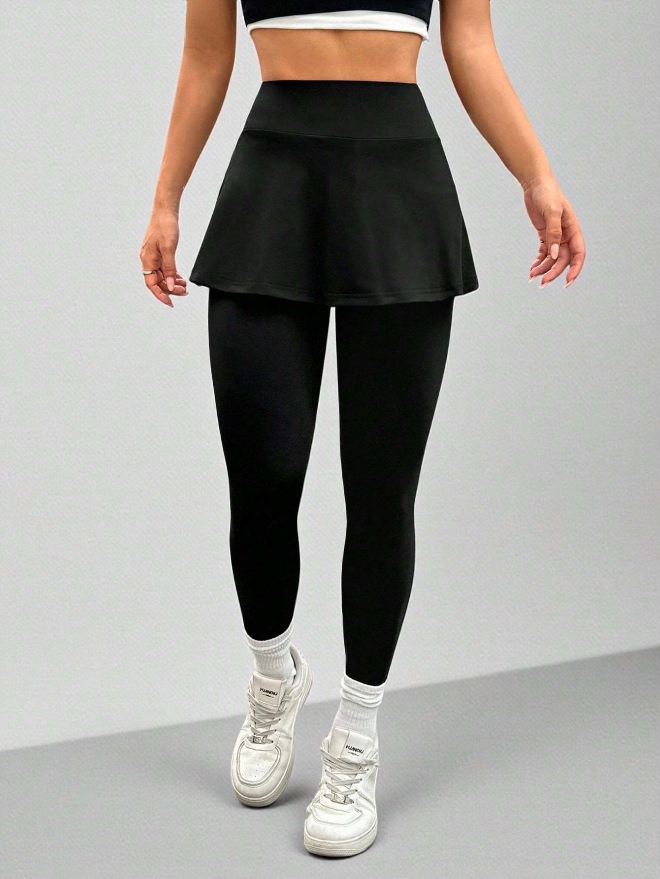 Calça Legging Com Saia Embutida E Bolso Lateral