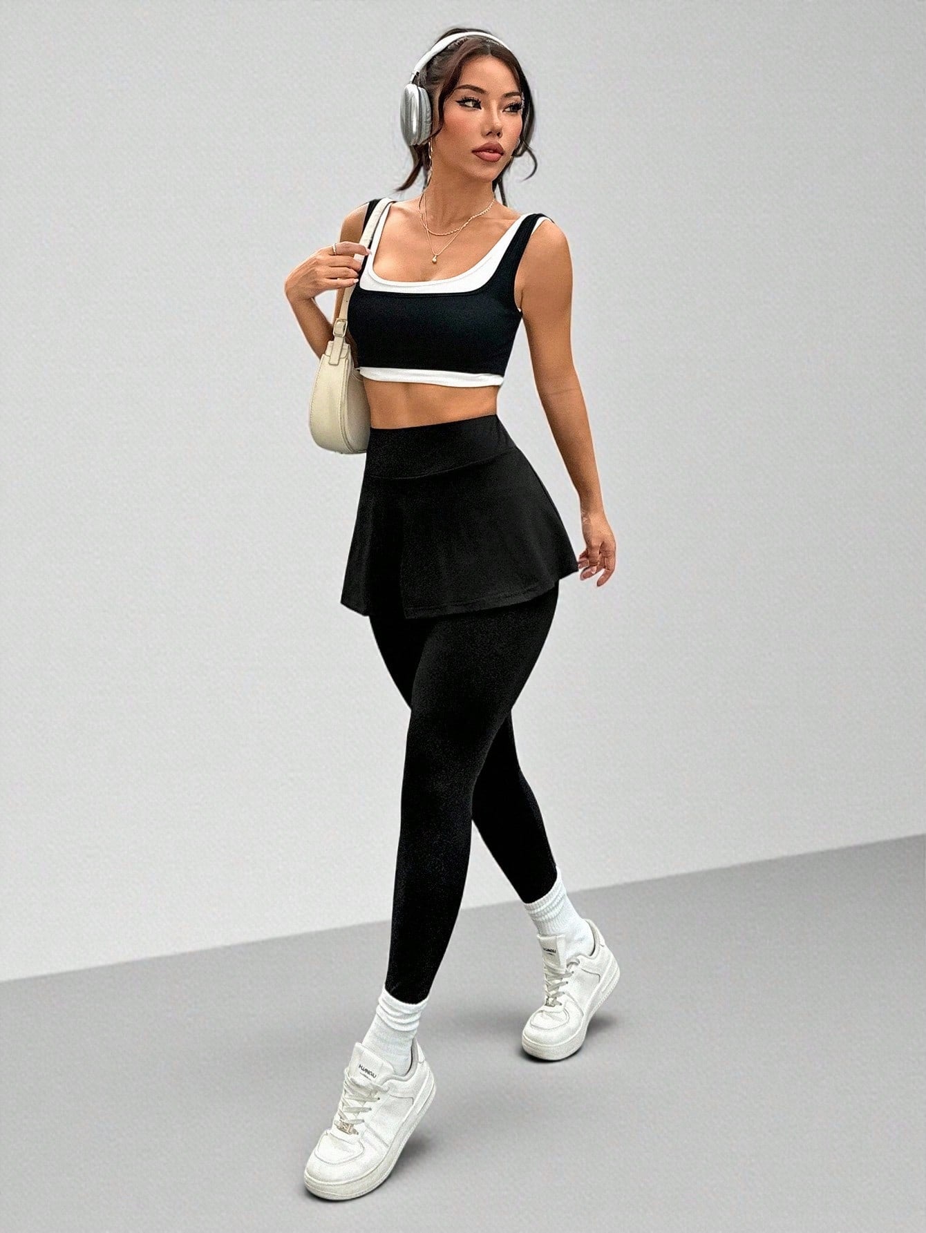 Calça Legging Com Saia Embutida E Bolso Lateral
